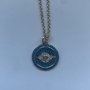 Blue and gold evil eye necklace